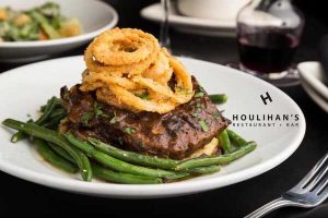 steak with green beans and fried onions from Houlihan's