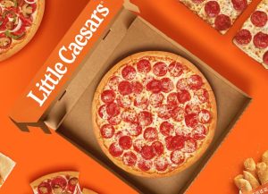 pepperoni pizza in box with little caesar's logo